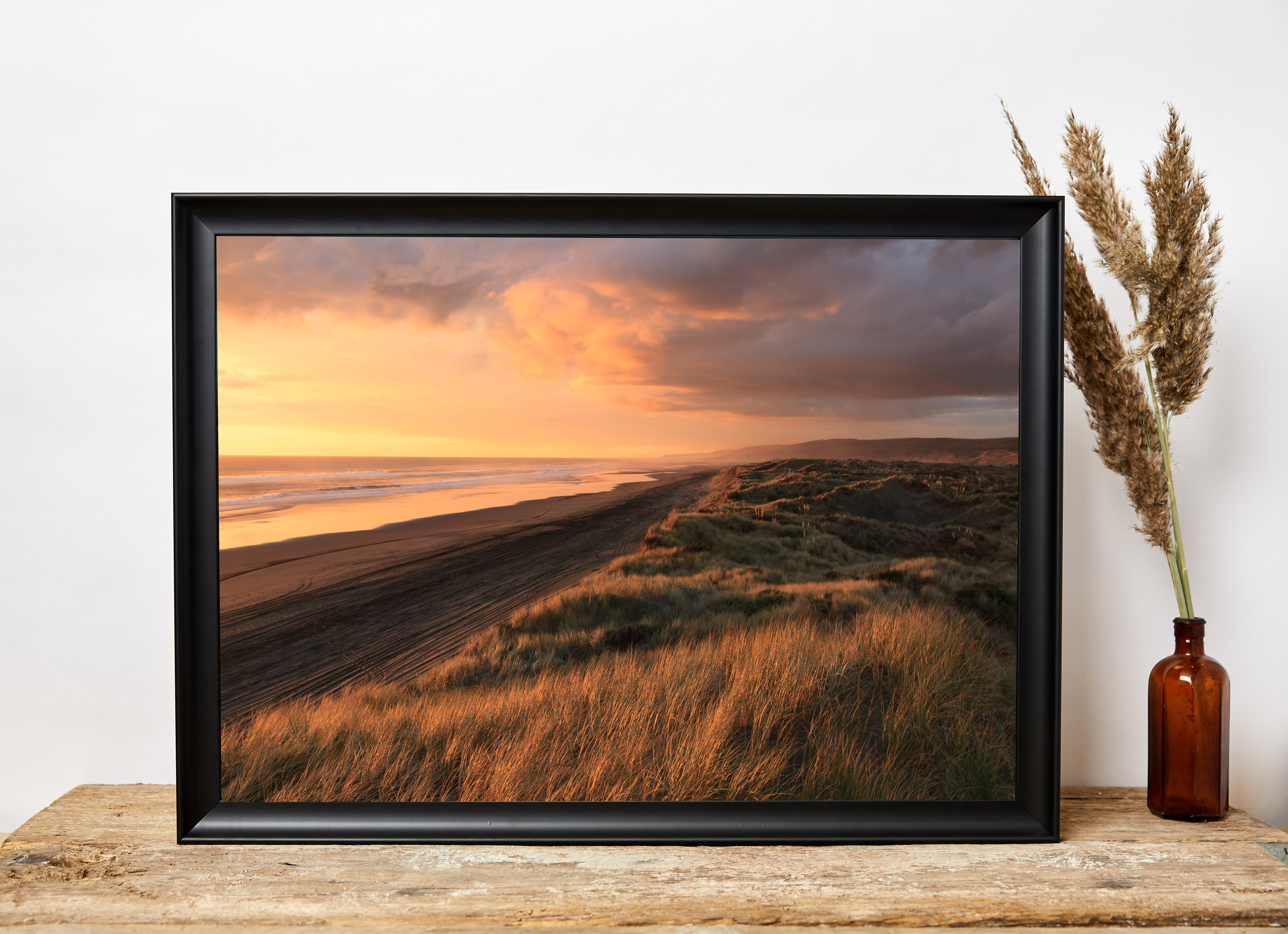 beautiful golden hour photograph displayed in a classic black custom photo frame